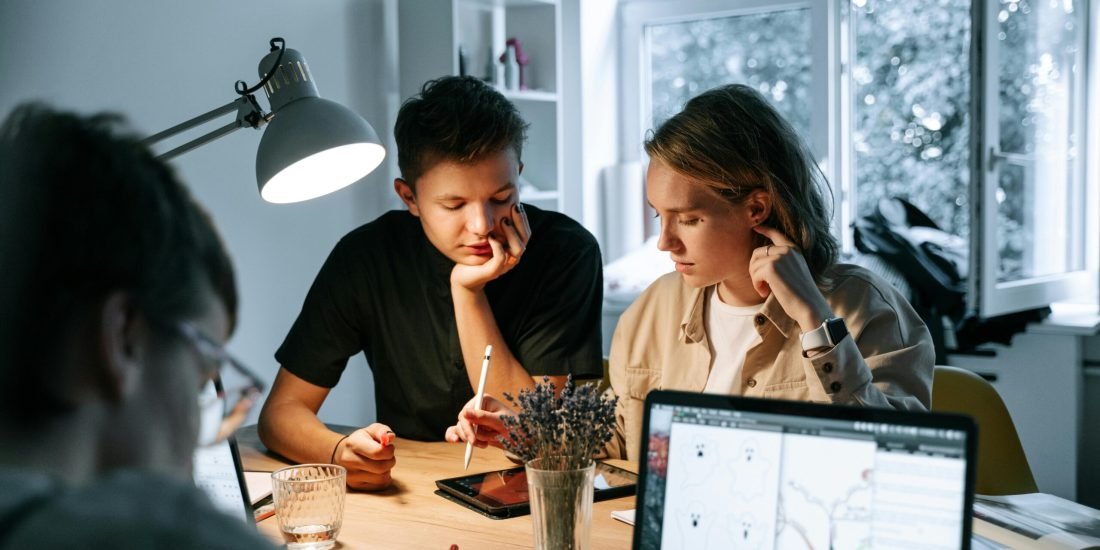 Dynamic team of young professionals brainstorming ideas in a modern office setting.